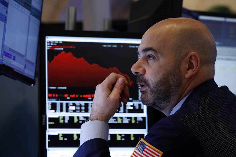 Trader Fred DeMarco works Friday on the floor of the New York Stock Exchange as concerns over the spreading coronavirus continued to grip financial institutions. The fears have caused U.S. stocks to lose nearly $3.6 trillion in value since Feb. 19.
(AP/Richard Drew)