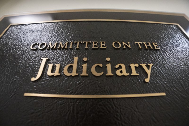 FILE - In this May 29, 2019 file photo, a sign at the office of the House Judiciary Committee is seen on Capitol Hill in Washington. The House Judiciary Committee is launching a wide-ranging probe of Attorney General William Barr and the Justice Department, demanding briefings, documents and interviews with 15 officials about whether there has been improper political interference in federal law enforcement. (AP Photo/J. Scott Applewhite)