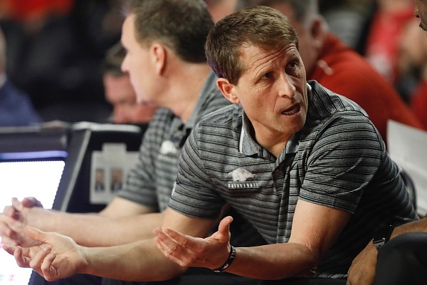 Arkansas coach Eric Musselman speaks with his staff during the team's NCAA college basketball game against Georgia in Athens, Ga., Saturday, Feb. 29, 2020. (Joshua L. Jones/Athens Banner-Herald via AP) Arkansas coach Eric Musselman speaks with his staff during the team's NCAA college basketball game against Georgia in Athens, Ga., Saturday, Feb. 29, 2020. (Joshua L. Jones/Athens Banner-Herald via AP)