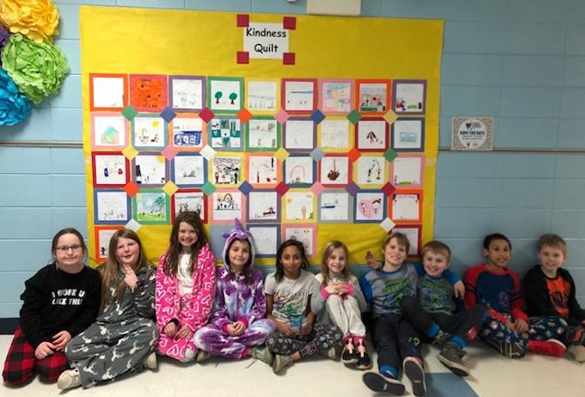 Magnet Cove Elementary participated in the Great Kindness Challenge. A kindness quilt was created by students featuring acts of kindness. From left are Aubrey Hollomon, Zoey Tacker, Addison Nuckolls, Jade McWhirter, Amity Wilkinson, Alli Kemp, Larry Morris Josh Stiles, Jake Minor and Jace Wilson. - Submitted photo