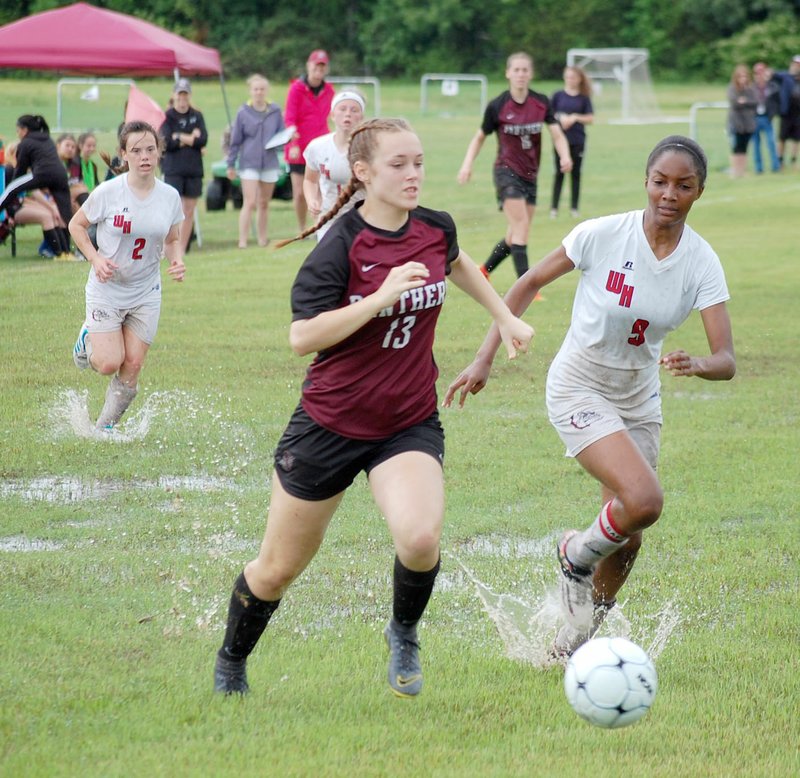 Graham Thomas/Siloam Sunday Siloam Springs forward Madi Race runs through a wet field during the 2019 Class 5A state tournament against White Hall. Race and the Lady Panthers soccer team open the 2020 season Monday at Harrison.