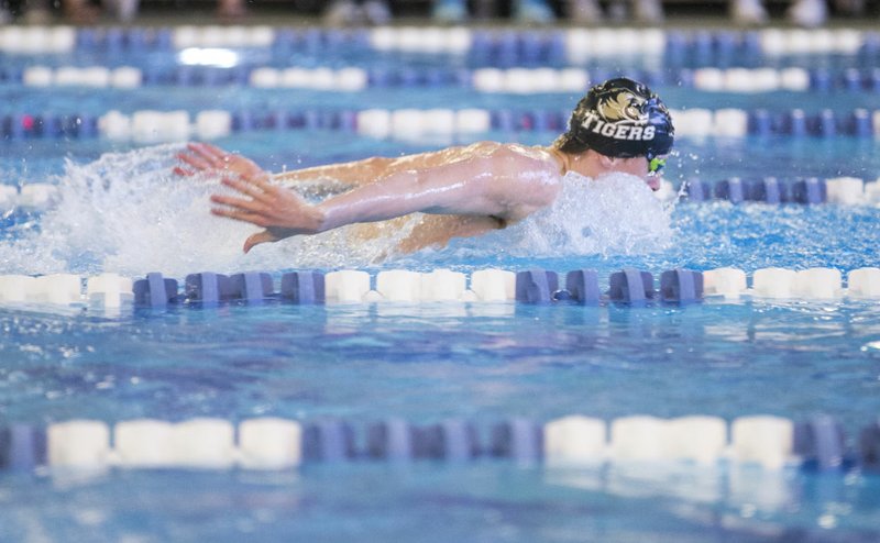 Ryan Husband of Bentonville swims in the boys 100 yard butterfly Saturday, Feb. 29, 2020, during the class 6A swim and dive state championships at the Bentonville Community Center. Husband won the event with a time of 49.59 seconds. Go to nwaonline.com/photos to see more photos. (NWA Democrat-Gazette/Ben Goff)
