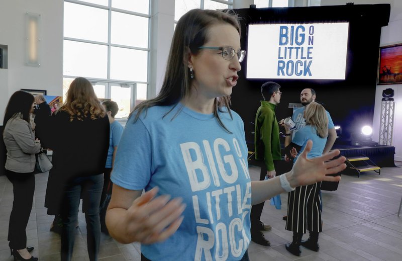 Gretchen Hall, Little Rock Convention and Visitors Bureau president, sports a blue shirt Thursday bearing the organization's new slogan. The bureau unveiled a new advertising campaign at the atrium of the Statehouse Convention Center in Little Rock. (Arkansas Democrat-Gazette/John Sykes Jr.)