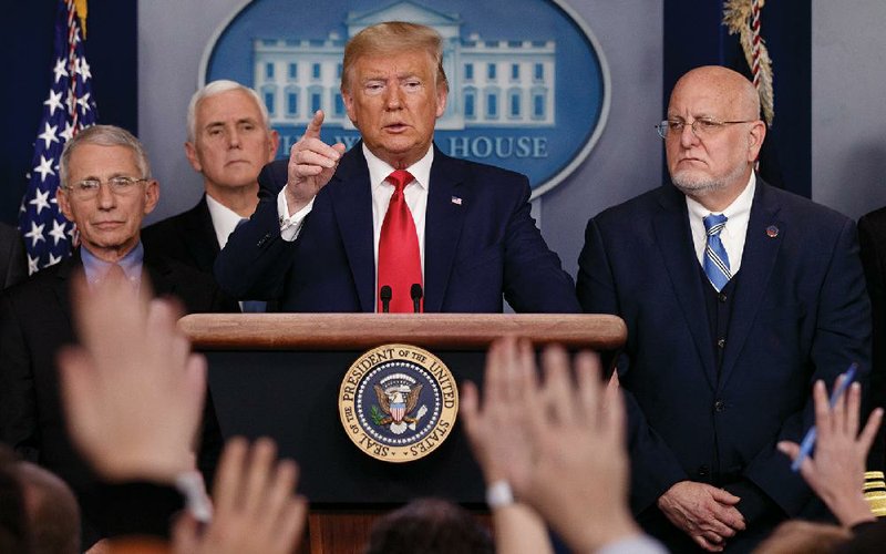“This is very serious stuff,” President Donald Trump said Saturday at the White House during a news conference on the coronavirus, but he encouraged Americans to keep to their daily routines because the country is “super prepared.” More photos at arkansasonline.com/31outbreak/.
(AP/Carolyn Kaster)