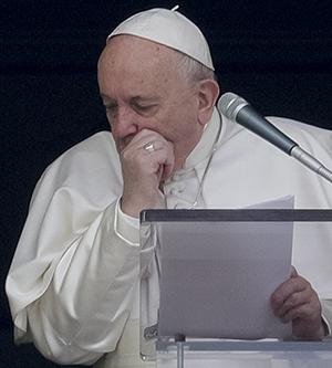 Pope Francis coughs during the Angelus noon prayer he recited from the window of his studio overlooking St. Peter's Square, at the Vatican, Sunday, March 1, 2020. A coughing Pope Francis told pilgrims gathered for the traditional Sunday blessing that he is canceling his participation at a week-long spiritual retreat in the Roman countryside because of a cold. It is the first time in his seven-year papacy that he has missed the spiritual exercises that he initiated early in his pontificate to mark the start of each Lenten season. (AP Photo/Andrew Medichini)