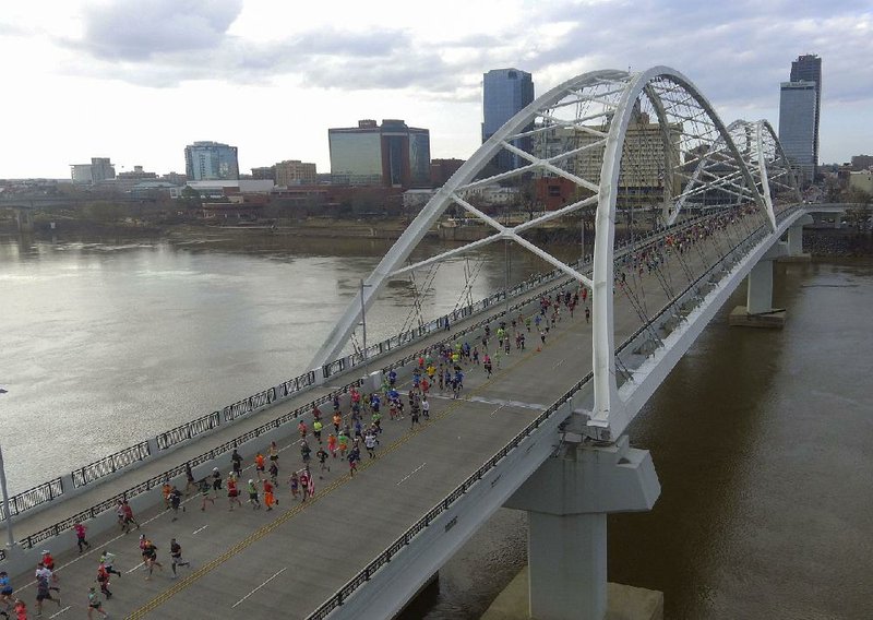 Runners make their way across the Broadway Bridge on March 1, 2020 in the early miles of the Little Rock Marathon. (Arkansas Democrat-Gazette/Staton Breidenthal)