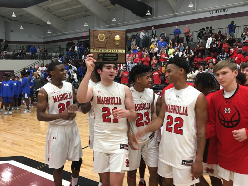 Magnolia senior Kyle Carver holds up the Class 4A South Region Championship plaque after the unbeaten Panthers defeated Monticello 59-48 in the finals at Crossett. At Farmington this week, the Panthers (25-0) received a first-round bye and will play at 5:30 p.m. Friday against either Blytheville or Dardanelle. A victory would put the defending Class 4A State Champions in Saturday night’s semifinal round at 7:30 p.m. The state finals will be at 7:45 p.m. Friday, March 13, in Hot Springs.