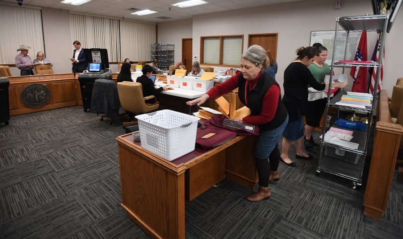 Washington County Election Commission workers process ballots as they come in from polling places Tuesday March 3, 2020 at the Washington County Courthouse in Fayetteville. Visit nwaonline.com/200304Daily/ for more images.
