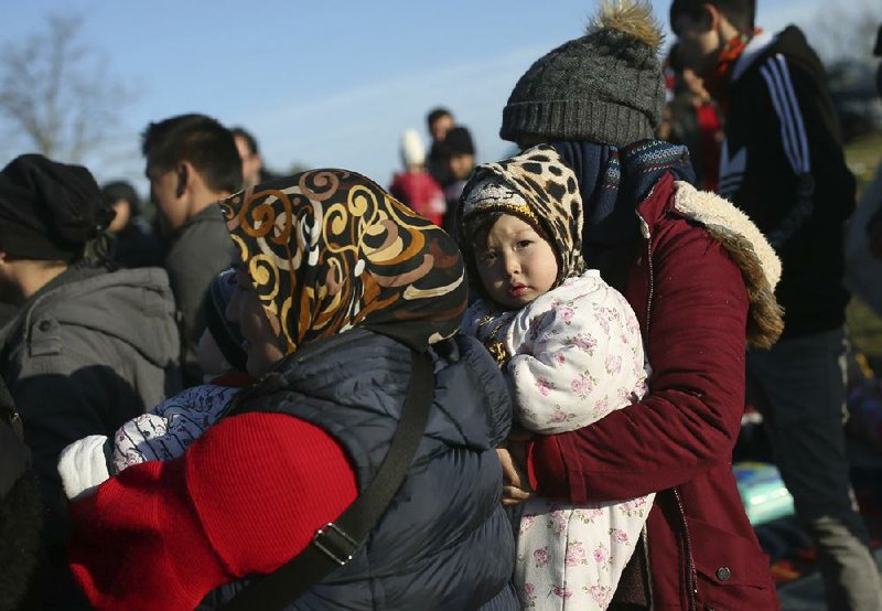 Migrants gather Monday at a field near Edirne, Turkey, on the country’s border with Greece. (AP/Emrah Gurel) 
