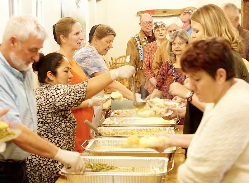 Westside Eagle Observer/RANDY MOLL The staff of the Wooden Spoon Restaurant in Gentry serve guests at the Gentry Chamber of Commerce Awards Banquet on Tuesday, Feb. 25.