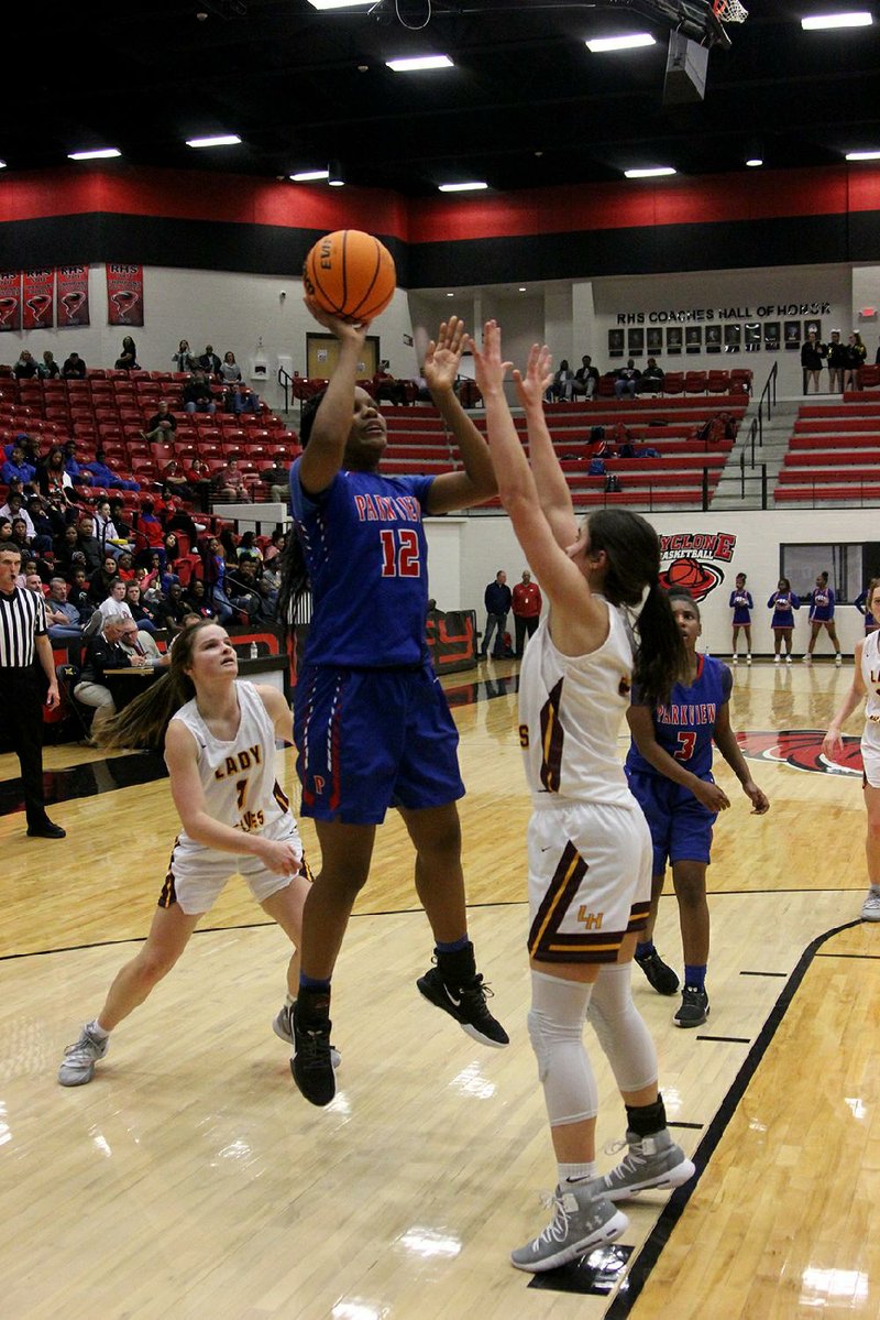 Little Rock Parkview’s Deanna Kamanga (12) takes a shot between two Lake Hamilton defenders Tuesday during the Lady Patriots 56-47 victory over the Lady Wolves at the Class 5A girls state tournament in Russellville.
(The Sentinel-Record/James Leigh)