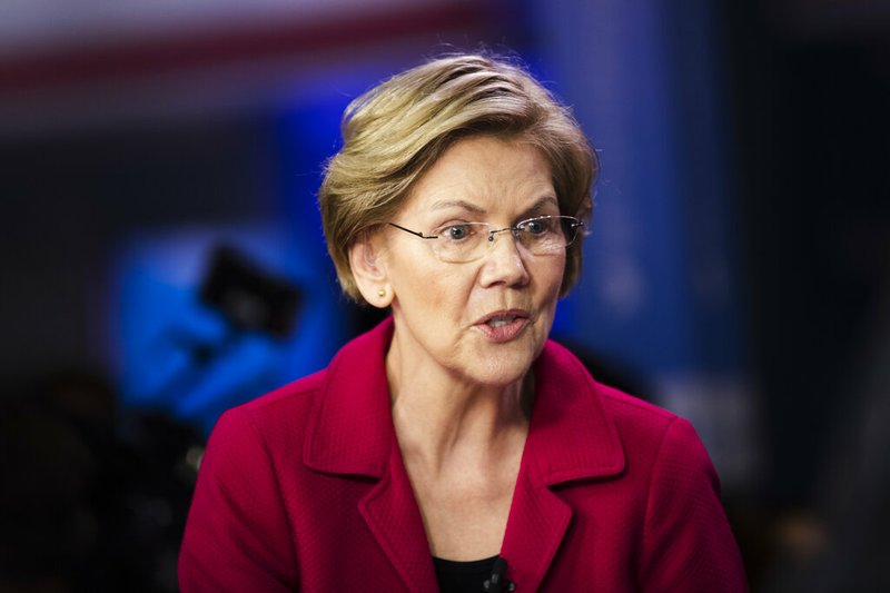 FILE - In this Feb. 25, 2020 file photo, Democratic presidential candidate Sen. Elizabeth Warren, D-Mass., speaks with members of the media after a Democratic presidential primary debate in Charleston, S.C. (AP Photo/Matt Rourke)