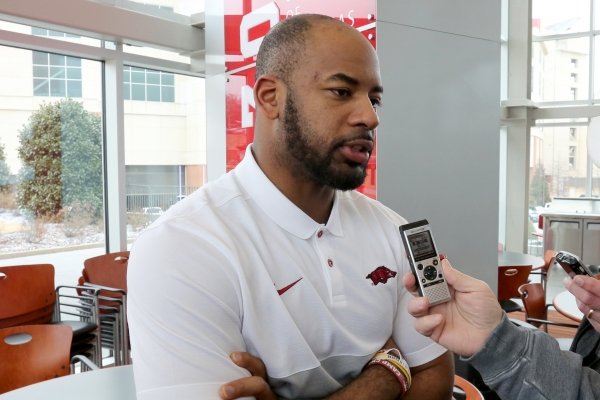 Sam Carter, an assistant coach with the Arkansas football team, speaks with members of the media Thursday, February 6, 2020, inside the Fred W. Smith Football Center on the campus in Fayetteville. Ten football assistants participated in the interview process.