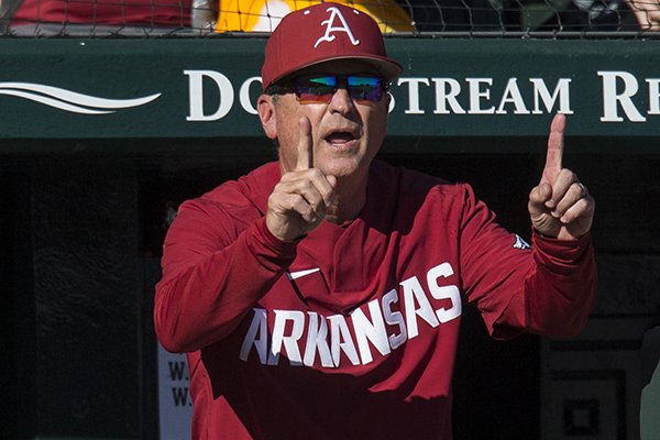 Arkansas coach Dave Van Horn signals from the dugout during a game against South Alabama on Friday, March 6, 2020, in Fayetteville. 