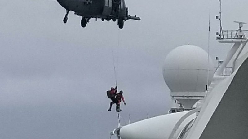 A California National Guard team delivers virus testing kits to the Grand Princess cruise ship Thursday off the California coast, where it has been ordered to stay until testing of its crew and passengers is completed.
(AP/Michele Smith)