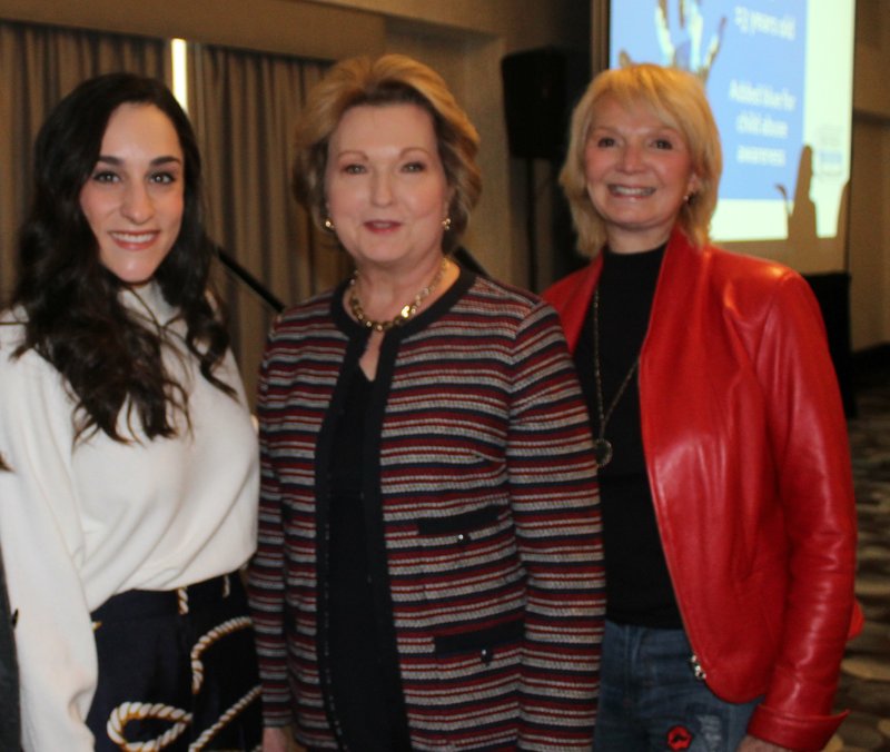 Jordyn Wieber, University of Arkansas gymnastics coach (from left); Susan Hutchinson and Mary Bassett visit at the Partners+Prevention Luncheon to benefit the Children's Safety Center of Washington County on Feb. 25 at the Hilton Garden Inn in Fayetteville. (NWA Democrat-Gazette/Carin Schoppmeyer)