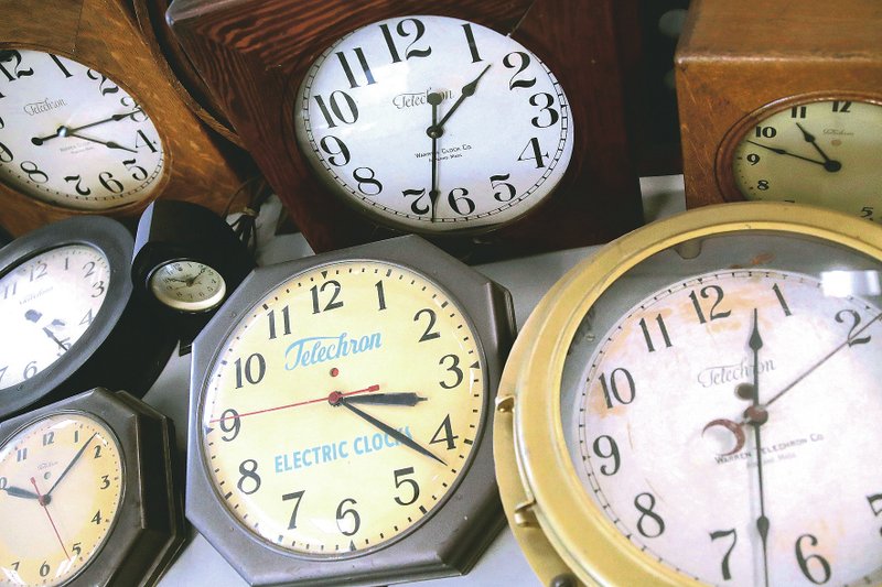 Antique clocks are displayed at the Electric Time Company, in Medfield, Mass. (AP/Charles Krupa)