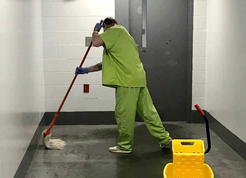 A Washington County Detention Center inmate cleans the floor inside the jail. (Courtesy Photo/Washington County Sheriff's Office)