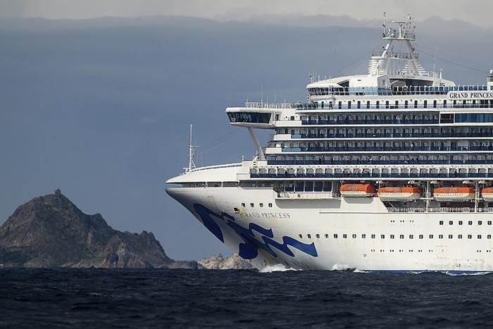 The Grand Princess cruise ship on Sunday passes the Farallon Islands off the coast of San Francisco. The ship, carrying a small number of people who have tested positive for the coronavirus, is scheduled to dock in Oakland, Calif., today. More photos at arkansasonline.com/39covid/.
(AP/Noah Berger)