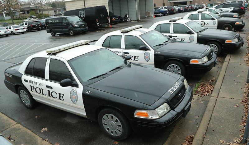 The Hot Springs Police Department's fleet sits at the ready behind the department's Malvern Avenue headquarters Monday. The Hot Springs Board of Directors authorized the purchase of 11 new Ford sport-utility vehicles for the department. - Photo by Richard Rasmussen of The Sentinel-Record