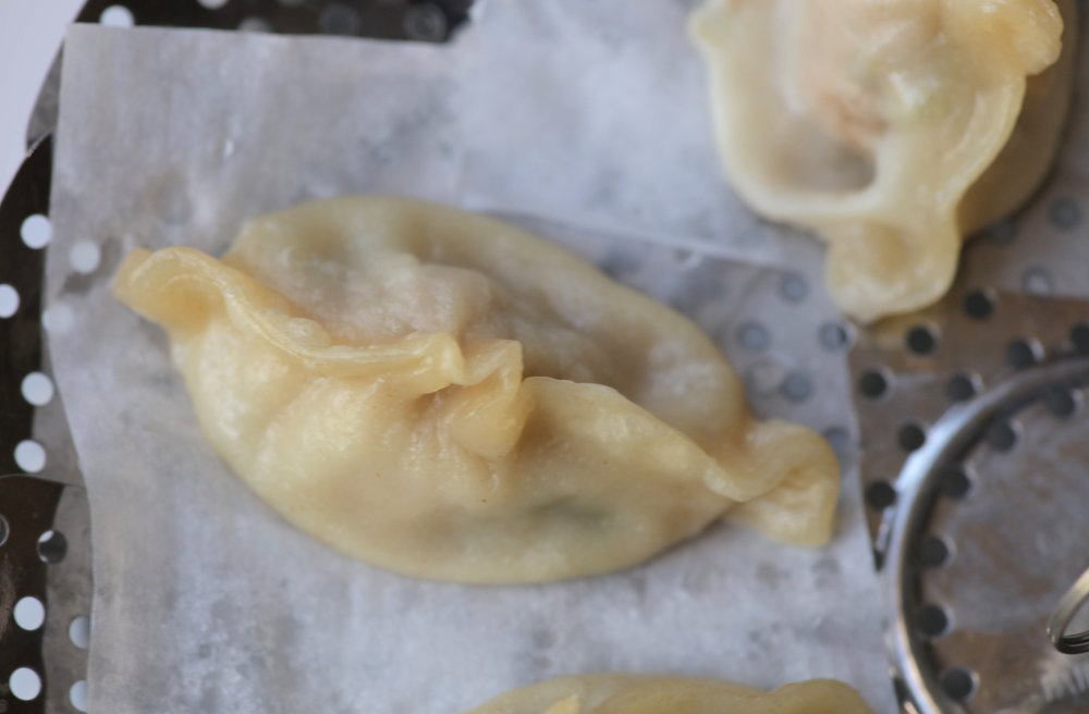Dumplings can be steamed using a metal vegetable steamer lined with parchment paper. (Arkansas Democrat-Gazette/John Sykes Jr.)
