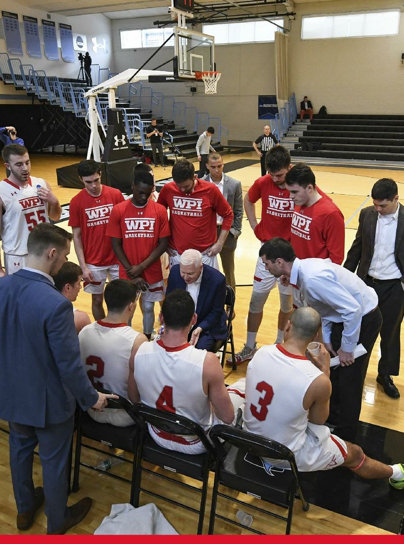 Worcester Poly- technic Institute Coach Chris Bartley talks with his team during a timeout against Yeshiva during a rst-round game of the men’s col- lege basketball NCAA Division III Tournament on Friday at Johns Hopkins University in Baltimore. The school hosted the game without spectators after cases of the coronavirus were con rmed in Maryland. (AP/Terrance Williams) 
