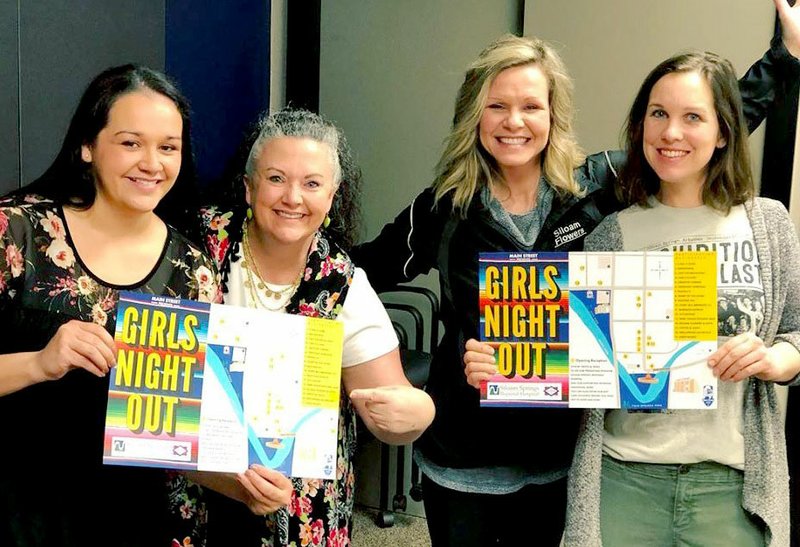 Photo Submitted Alma Sanchez (left), Julie Chandler, Melanie Provost and Dorothy Letellier hold posters for Girls Night Out.