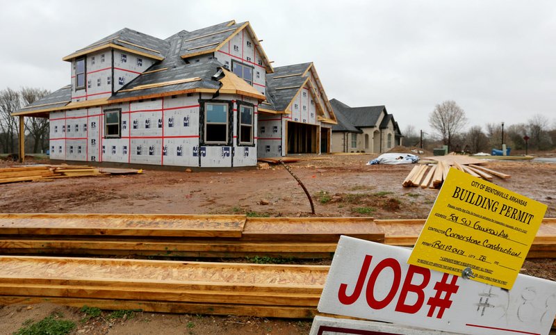 A single family house is under construction Monday at the corner of Gunison Cove and Coler Creek Avenue in Bentonville. Despite rising prices and shrinking inventory, 4,910 new and existing homes were sold in the second half of 2019, for the highest six-month number of recorded sales since the Skyline Report began tracking them in 2004. Go to nwadg.com/photos for a photo gallery. (NWA Democrat-Gazette/David Gottschalk)