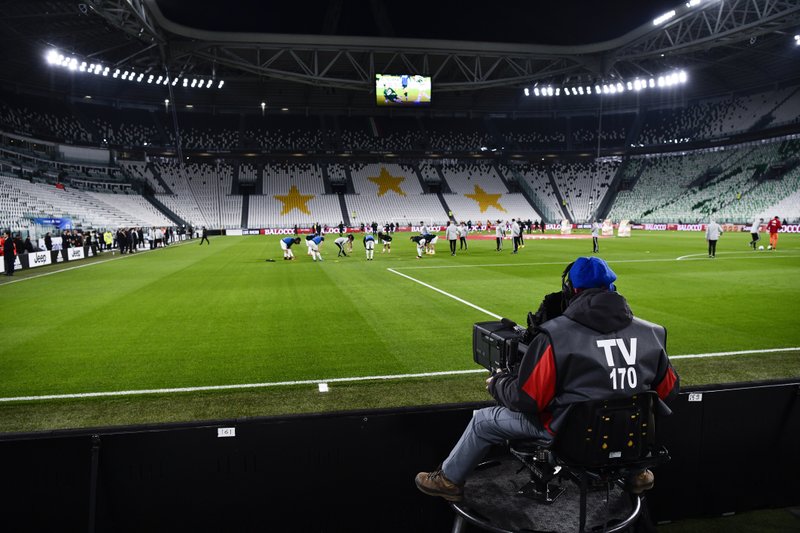 A view of the empty Juventus stadium, as a measure against coronavirus contagion, prior to the Serie A soccer match between Juventus and Inter, in Turin, Italy, Sunday, March 8, 2020. Serie A played on Sunday despite calls from Italy&#x2019;s sports minister and players&#x2019; association president to suspend the games in Italy&#x2019;s top soccer division. (Marco Alpozzi/LaPresse via AP)