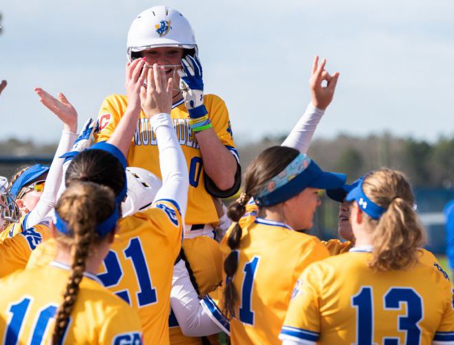 Lady Muleriders celebrate with Jaxynn Dyson following a home run. (Photo by SAU Sports)