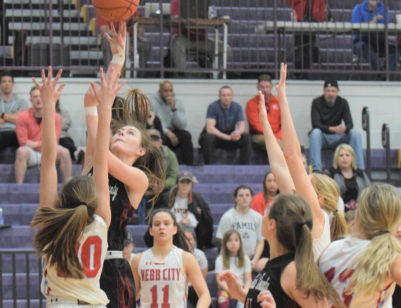 RICK PECK/SPECIAL TO MCDONALD COUNTY PRESS McDonald County's Sydney Killion shoots over Webb City's Kate Brownfield during the Lady Mustangs' 42-33 loss on March 3 in the semifinals of the Missouri Class 4, District 12, Basketball Tournament.