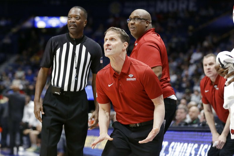 Arkansas head coach Eric Musselman reacts to a call in the first half of an NCAA college basketball game against Vanderbilt in the Southeastern Conference Tournament Wednesday, March 11, 2020, in Nashville, Tenn. (AP Photo/Mark Humphrey)