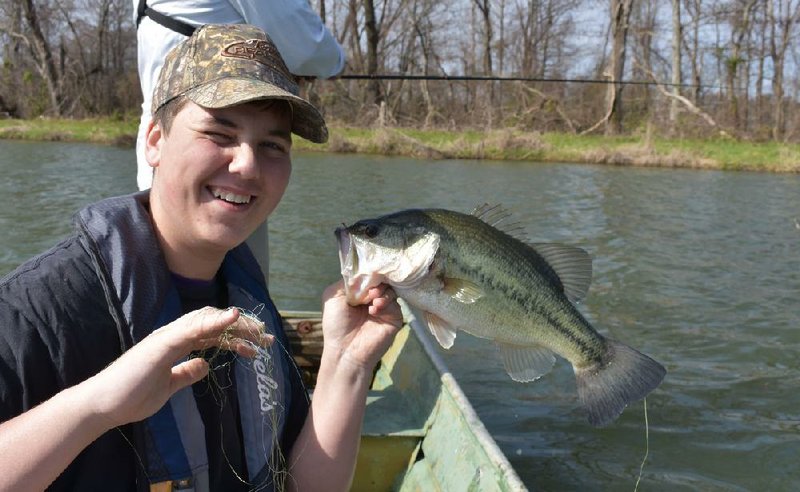 John Volpe of Little Rock caught the biggest bass of the day Sunday while pulling in a plastic worm on broken line with his hands.
(Arkansas Democrat-Gazette/Bryan Hendricks)