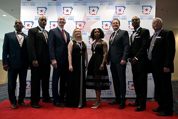 (From left) Ike Forte, John Tate, Jim Counce, Tamey Moore Harrison of the All American Redheads, Veronica Campbell Brown, Gus Malzahn, Anthony Lucas and Ron Marvel, the newest inductees to the Arkansas Sports Hall of Fame on Friday, March 13, 2020.