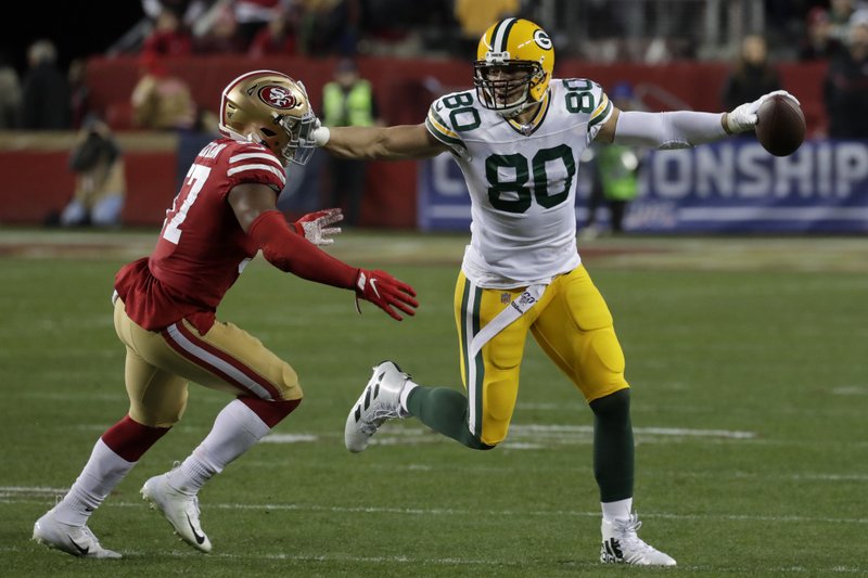 Green Bay Packers tight end Jimmy Graham, right, pushes San Francisco 49ers linebacker Dre Greenlaw away during the second half of the NFL NFC Championship football game Sunday, Jan. 19, 2020, in Santa Clara, Calif. (AP Photo/Matt York)