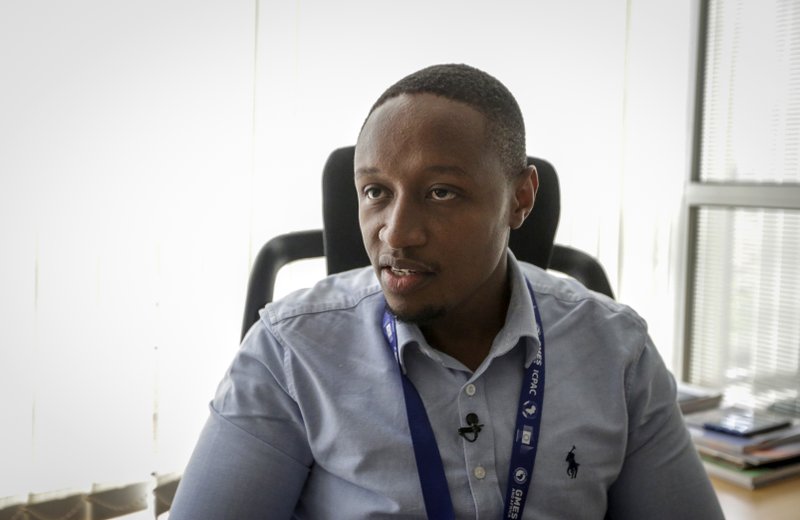 In this photo taken on Thursday, March 5, 2020, Kenneth Mwangi, a satellite information analyst at the Intergovernmental Authority on Development's Climate Prediction and Applications Center, speaks to The Associated Press in Nairobi, Kenya.  (AP Photo/Khalil Senosi)