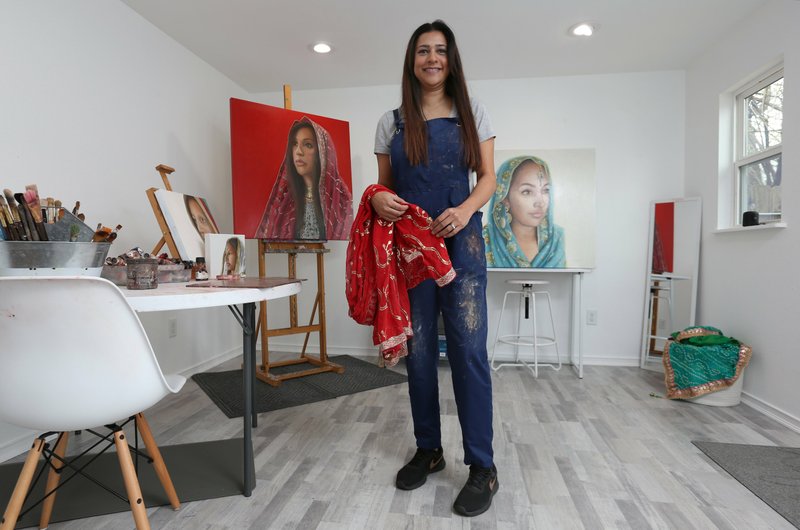 Shabana Kauser stands in her custom art studio Wednesday, March 4, 2020, located in the backyard of her Fayetteville home. Check out nwadg.com/photos for a photo gallery.
(NWA Democrat-Gazette/David Gottschalk) 