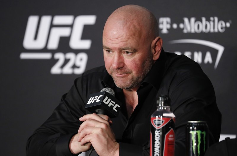 FILE - In this Oct. 6, 2018, file photo, Dana White, president of the UFC, speaks at a news conference after the UFC 229 mixed martial arts event in Las Vegas. The UFC is determined to fight on amid the worldwide coronavirus outbreak. The UFC hasn't canceled any competitions, even those previously scheduled for areas where large gatherings are now banned. White attributes his decision to go against the sports world's collective mindset partly to a conversation Thursday, March 12, 2020, with President Donald Trump and Vice President Mike Pence. (AP Photo/John Locher, File)