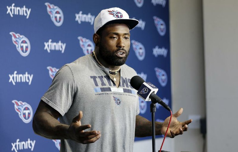 FILE - In this April 15, 2019, file photo, Tennessee Titans tight end Delanie Walker answers questions during a news conference in Nashville, Tenn. The Tennessee Titans have waived three-time Pro Bowl tight end Delanie Walker after injuries ended each of his last two season. The Titans announced the move Friday, March 13, 2020. (AP Photo/Mark Humphrey, File)