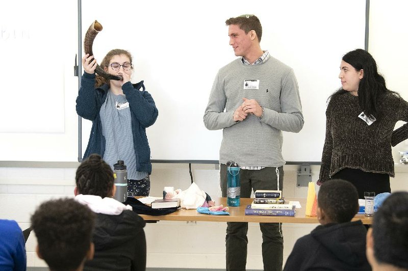 High school students Abby Ehrenstein, Ezra Diament and Nava Kahn from the Jewish Community Relations Council speak to students at Montgomery County Middle School in Maryland in January.
(Montgomery County Public Schools/Dan Gross)