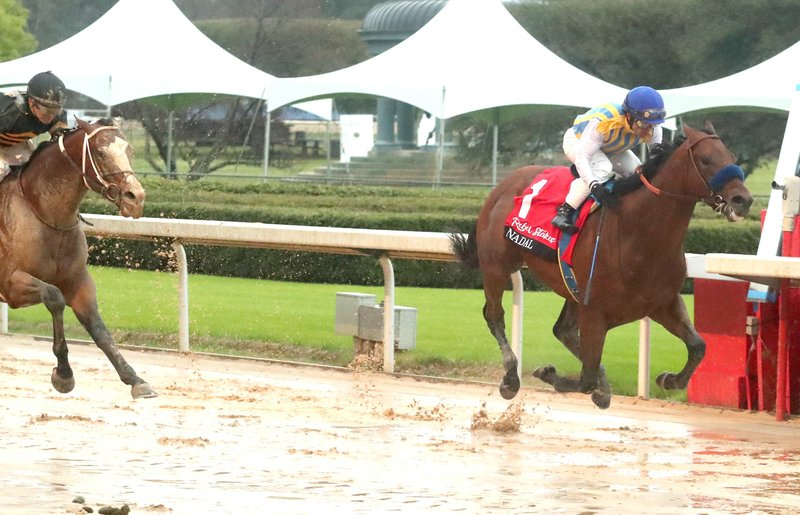 Jockey Joel Rosario and Nadal (1) pass the wire ahead of Excession (2) and jockey Tyler Baze to win the Rebel Stakes at Oaklawn Racing Casino Resort Saturday, March 14, 2020. - Photo by Richard Rasmussen of The Sentinel-Record