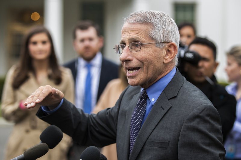Dr. Anthony Fauci, director of the National Institute of Allergy and Infectious Diseases, speaks Sunday during a brie ng on the coro- navirus in the James Brady Press Brie ng Room of the White House. He is joined by Vice President Mike Pence (left). (AP/Alex Brandon) 