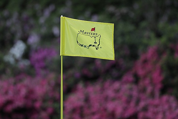 In this April 11, 2019, file photo, the flag on the 13th hole blows in the wind during the first round for the Masters golf tournament in Augusta, Ga. (AP Photo/David J. Phillip, Fil)

