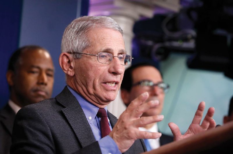 Dr. Anthony Fauci is simultaneously advocating containment to try to keep the virus from spreading, mitigation to check its damage once it gets loose in a community, immediate efforts to increase testing, and short-term and long-term science to develop treatments and vaccines. More photos at arkansasonline.com/315fauci/.
(AP/Alex Brandon)