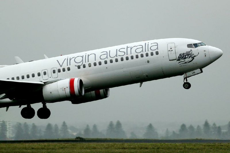 A Boeing Co. 737 aircraft operated by Virgin Australia Holdings Ltd. takes off from Sydney Airport in Sydney, Australia, in early March.
(Bloomberg/Brendon Thorne) story.lead_photo.caption