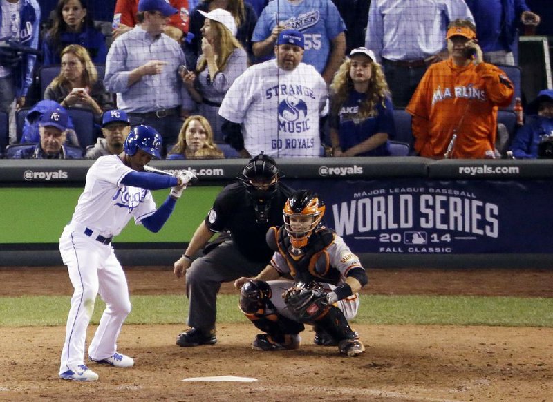 Miami Marlins fan Laurence Leavy (rear right) is seen here at a 2014 World Series game in Kansas City, Mo. Leavy, better known as “Marlins Man,” is wondering what he’s going to do while games won’t be played because of the coronavirus pandemic. 
AP le photo) 