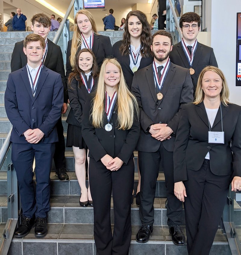 SUBMITTED Members of the Gravette HOSA (Health Occupations Students of America) Club pose with their medals at the Arkansas State HOSA Competition. Pictured are Seth Lewman (left, front), gold, biomedical laboratory science; Kylie Rutledge, gold, CERT; Tia Berger, silver, CERT; Mason Dagley, bronze, CERT; Robin Hilger, HOSA sponsor; James Duncan (left, rear), gold, biomedical laboratory science, Rylee Brewer, silver, CERT; Olivia Perry, gold, CERT; and Kaleb Furlow, bronze, CERT. These eight students have earned the right to compete at the national level.