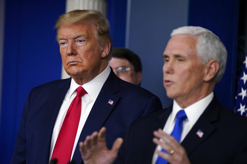 President Donald Trump listens as Vice President Mike Pence speaks during press briefing with the Coronavirus Task Force, at the White House, Wednesday, March 18, 2020, in Washington. story.lead_photo.caption