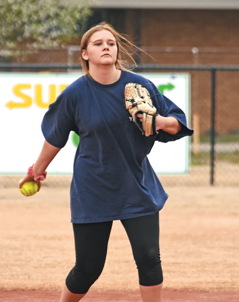 McCrory’s Kylee Hicks tosses the ball back to her teammate while running drills during practice on March 2.