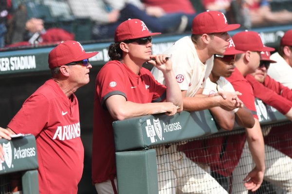 Arkansas' head coach Dave Van Horn (left) watches from the dugout during the Hogs' 10-9 win over Grand Canyon University Wednesday March 11, 2020 at Baum-Walker Stadium in Fayetteville. Van Horn, along with other spring sports coaches, were asked questions on a teleconference this week.